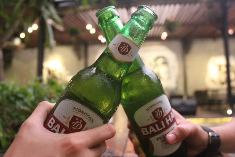 A toast of two bottles of Bali Hai beer