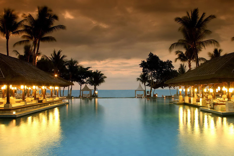 Sunset view of the swimming pool at InterContinental Bali Resort