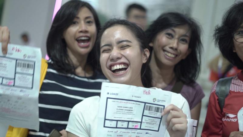 Excited supporters getting the tickets into the Closing Ceremony of Asian Games 2018.