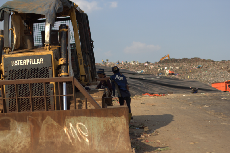 A picture of dump truck operating at the TPST Bantar Gebang, Bekasi.